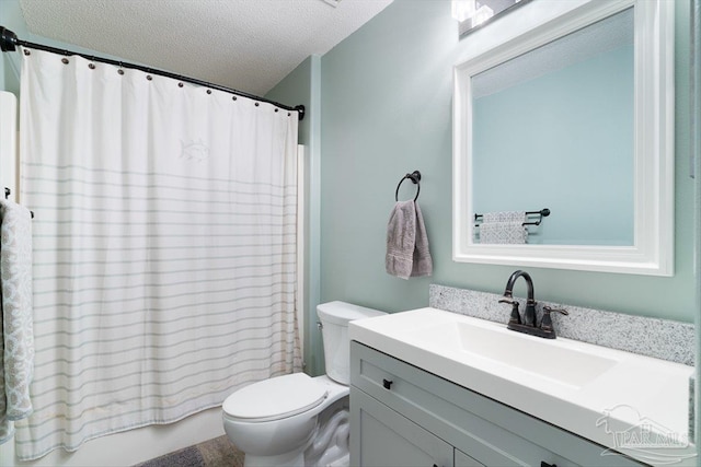 full bathroom with vanity, toilet, a textured ceiling, and shower / bath combo