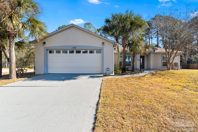 single story home with a garage and a front yard