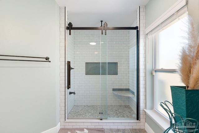 bathroom with a shower with shower door