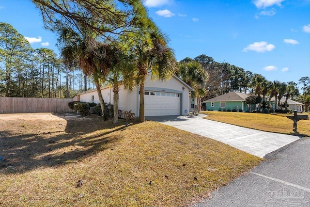 ranch-style home with a garage and a front lawn