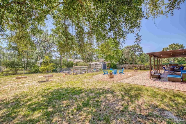 view of yard featuring a shed and a patio