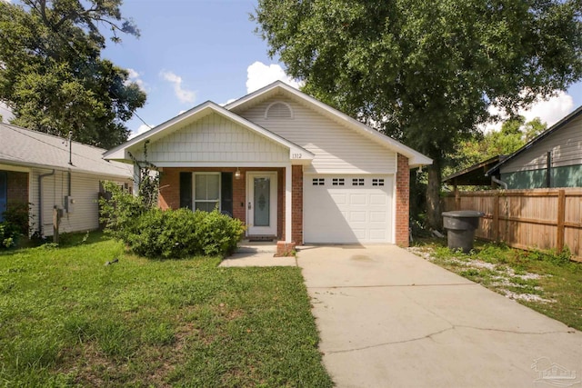 view of front of house with a front yard, fence, driveway, an attached garage, and brick siding