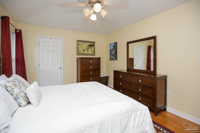 bedroom with wood-type flooring and ceiling fan