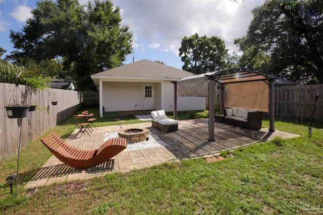 rear view of property with a pergola, a patio area, a yard, and an outdoor living space with a fire pit