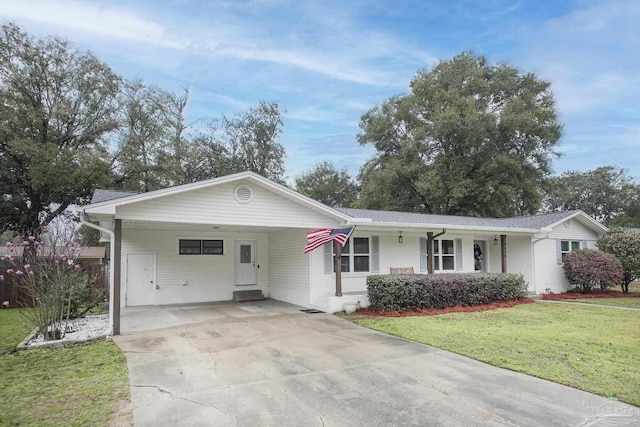 ranch-style house with a carport, concrete driveway, and a front yard