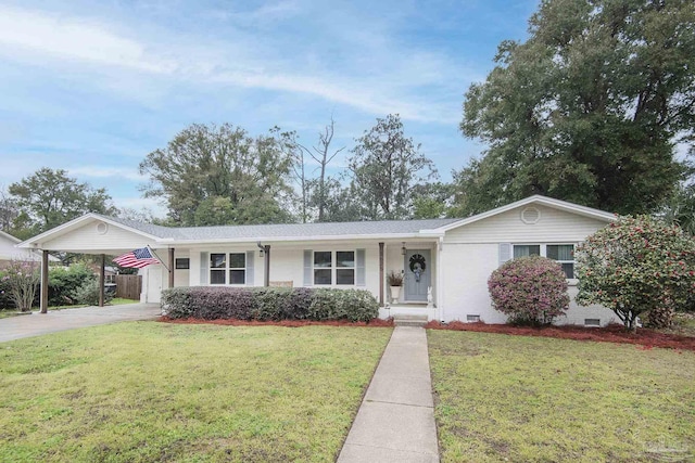 ranch-style home featuring crawl space, driveway, an attached carport, and a front yard