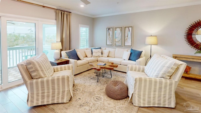 living room featuring recessed lighting, wood finished floors, and crown molding