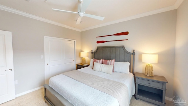 bedroom with ceiling fan, baseboards, ornamental molding, and carpet flooring