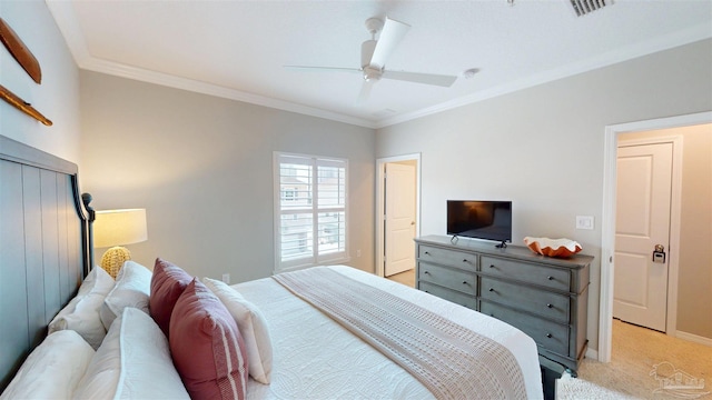 bedroom featuring visible vents, light colored carpet, baseboards, and ornamental molding