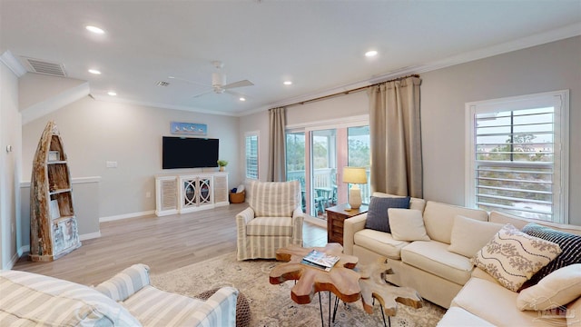 living area with visible vents, recessed lighting, light wood-style flooring, and ornamental molding