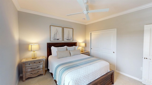 bedroom featuring ornamental molding, a closet, baseboards, light colored carpet, and ceiling fan