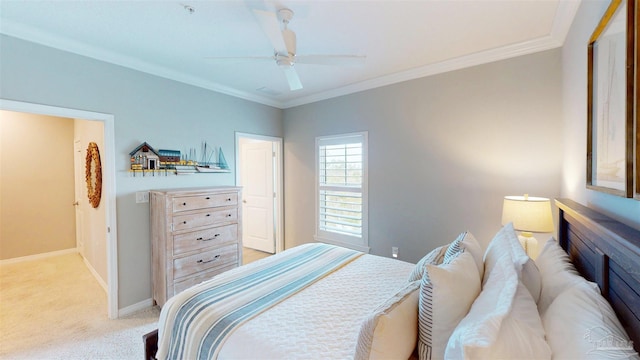 bedroom featuring light carpet, a ceiling fan, baseboards, and ornamental molding