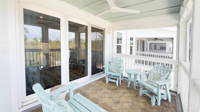 sunroom / solarium featuring ceiling fan