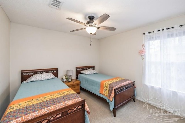 carpeted bedroom with ceiling fan