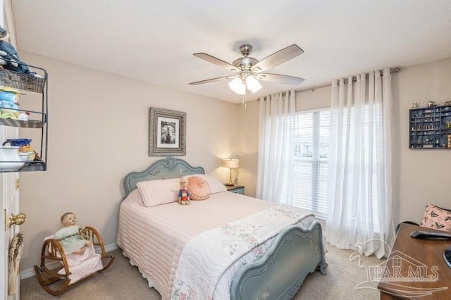 carpeted bedroom featuring ceiling fan