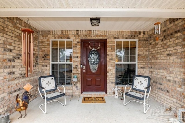 entrance to property featuring a porch