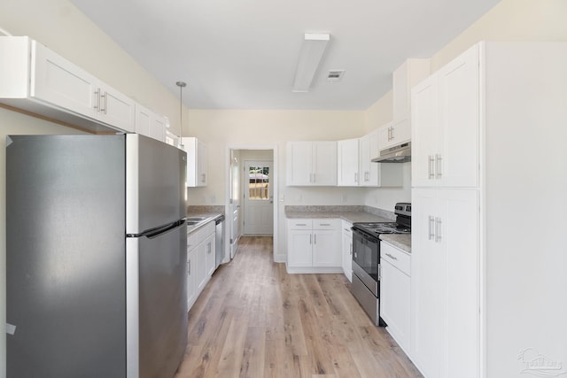 kitchen featuring visible vents, stainless steel appliances, light countertops, under cabinet range hood, and white cabinetry