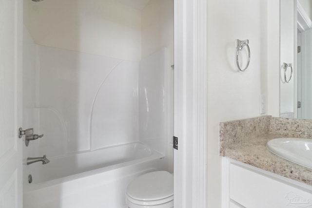 full bathroom featuring toilet, vanity, and bathing tub / shower combination