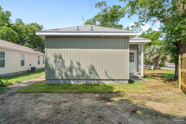 view of side of property with central AC unit