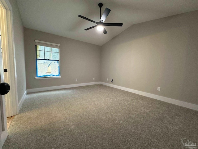 unfurnished room with vaulted ceiling, light carpet, and ceiling fan