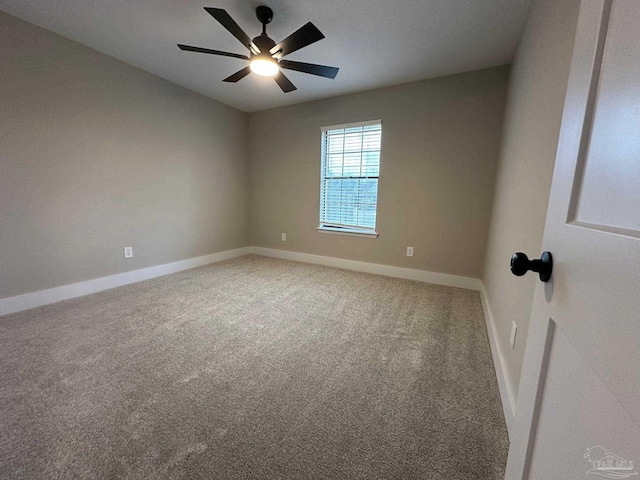 spare room with ceiling fan and carpet flooring