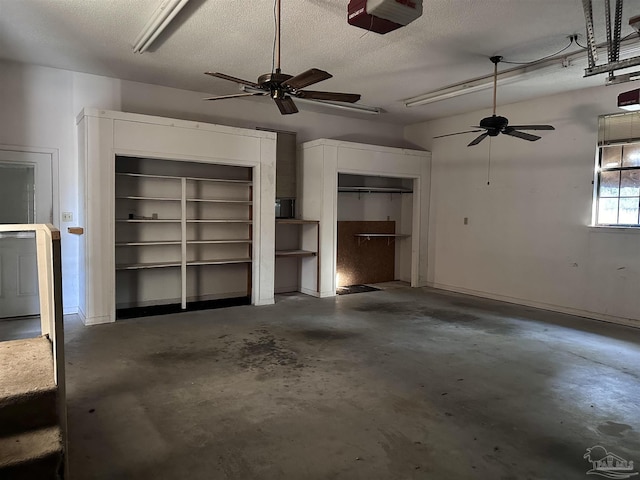 garage with a garage door opener and a ceiling fan