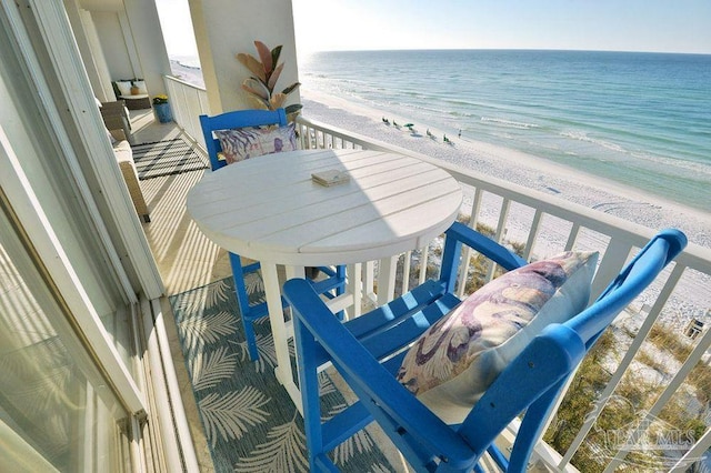 balcony featuring view of water and beach