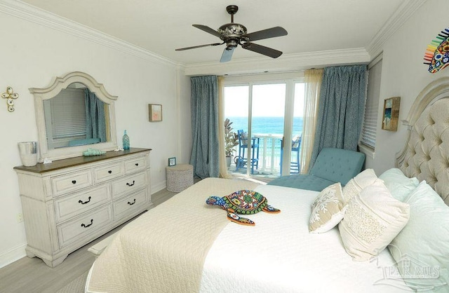 bedroom with access to exterior, baseboards, light wood-style floors, ornamental molding, and a water view