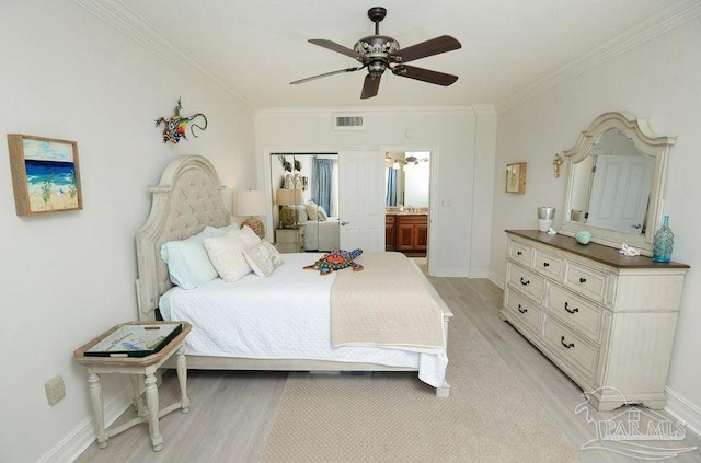 bedroom featuring light wood-style flooring, ornamental molding, baseboards, and a ceiling fan