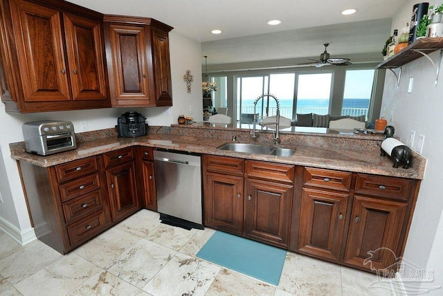 kitchen featuring stainless steel dishwasher, a sink, ceiling fan, a peninsula, and stone counters