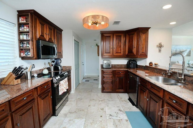 kitchen featuring stainless steel microwave, range with electric cooktop, a sink, dishwasher, and light stone countertops