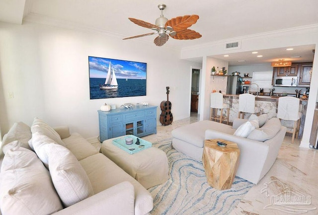 living area featuring ornamental molding, a ceiling fan, and recessed lighting