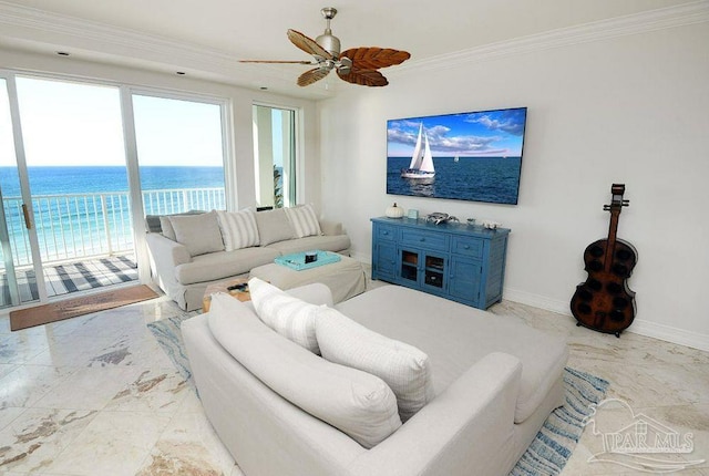 living room featuring marble tiled floors, ornamental molding, a ceiling fan, and baseboards