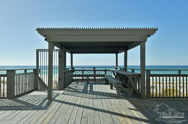 dock area with a deck with water view