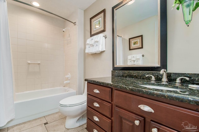 full bathroom featuring shower / bath combo with shower curtain, tile patterned flooring, vanity, and toilet