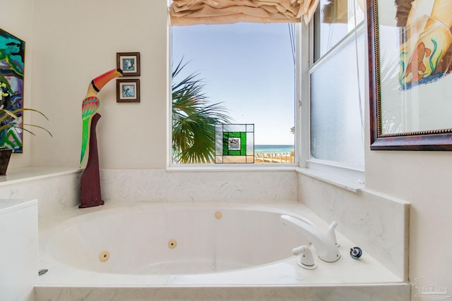 bathroom featuring a relaxing tiled tub