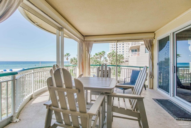 exterior space featuring a view of the beach and a water view