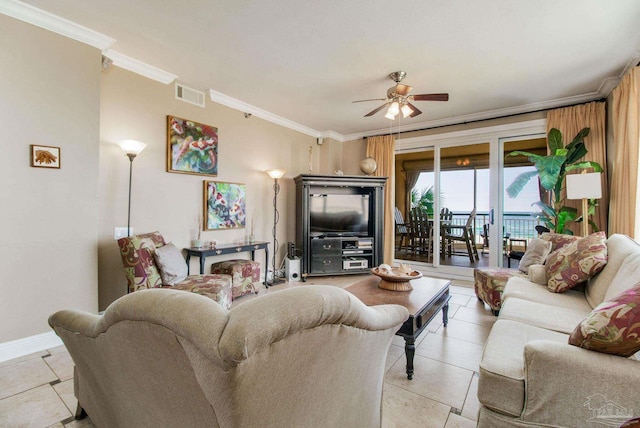 tiled living room featuring ornamental molding and ceiling fan