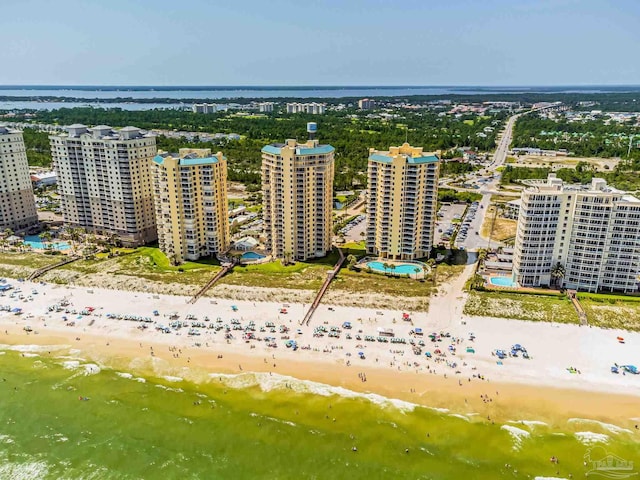 birds eye view of property featuring a water view and a view of the beach