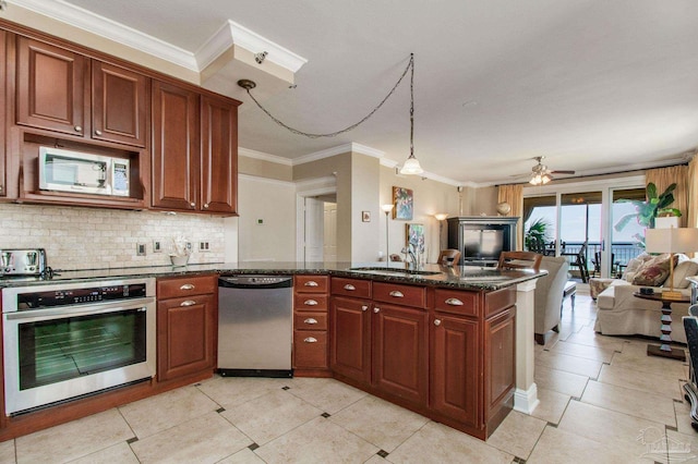 kitchen featuring appliances with stainless steel finishes, dark stone countertops, tasteful backsplash, ceiling fan, and sink