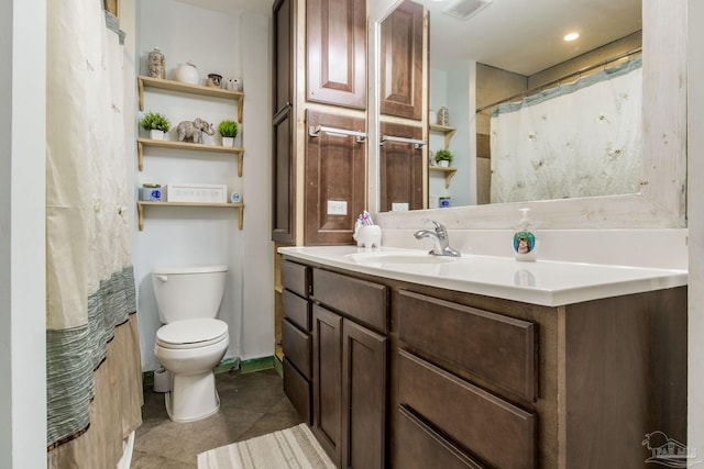 bathroom featuring vanity and toilet