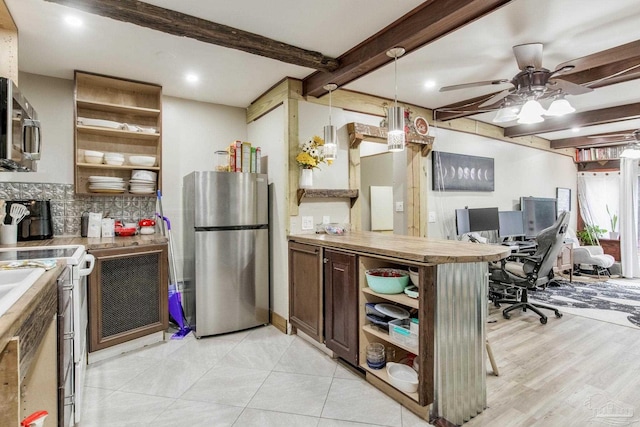 kitchen with stainless steel appliances, beamed ceiling, ceiling fan, tasteful backsplash, and hanging light fixtures