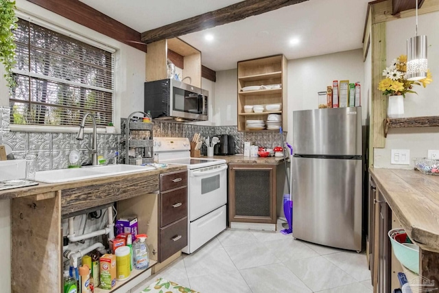 kitchen featuring stainless steel appliances, sink, light tile patterned floors, backsplash, and beam ceiling