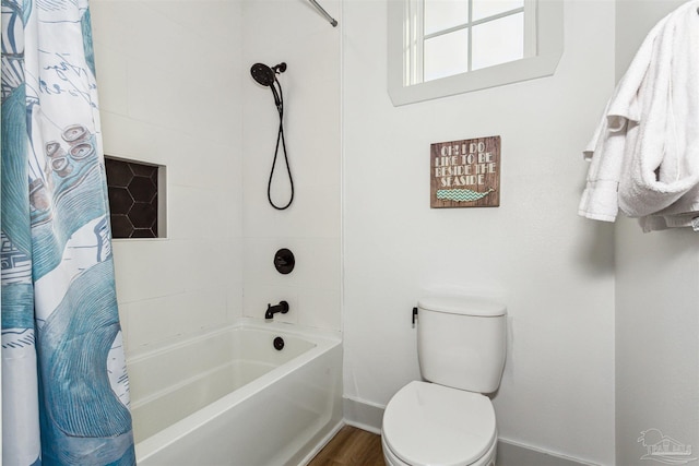 bathroom with toilet, shower / bathtub combination with curtain, and hardwood / wood-style flooring