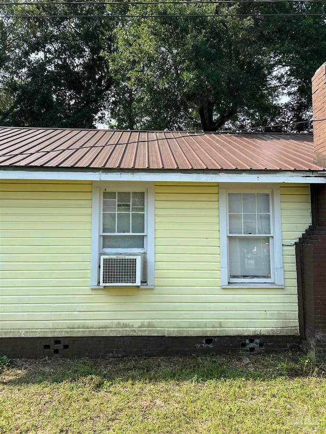 view of home's exterior featuring cooling unit and a yard