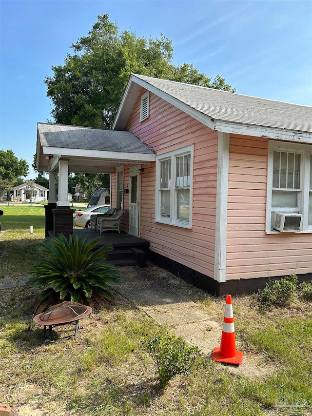 view of front of home featuring cooling unit