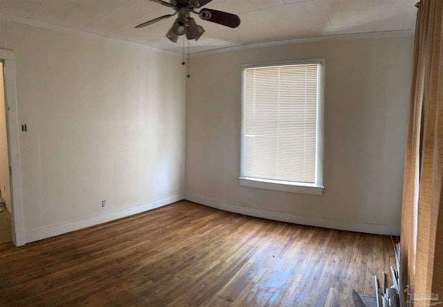 spare room featuring ceiling fan, dark hardwood / wood-style floors, and ornamental molding