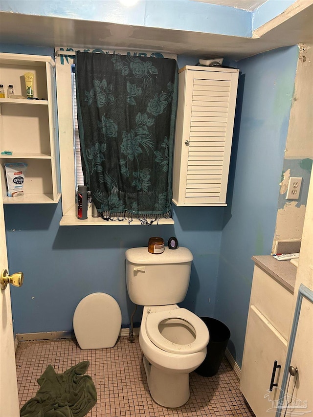 bathroom featuring toilet and tile patterned floors