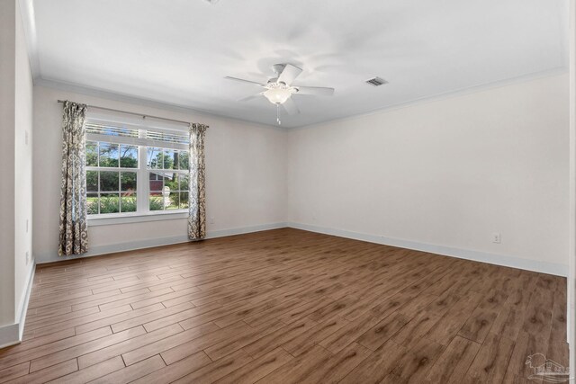 103 Florida Ave, Gulf Breeze, FL 32561 - empty room with wood finished floors, visible vents, a ceiling fan, ornamental molding, and baseboards