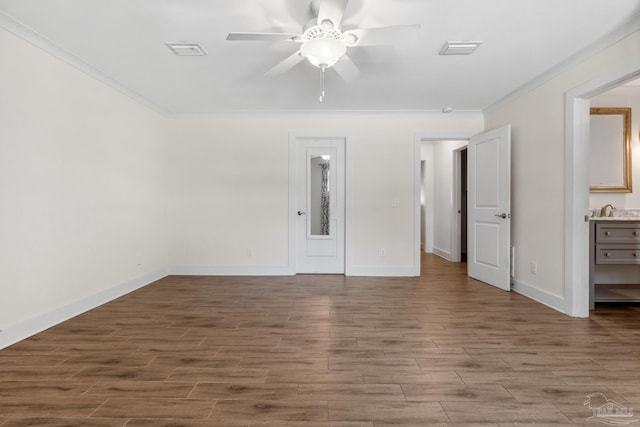 unfurnished bedroom with light hardwood / wood-style floors, crown molding, connected bathroom, and ceiling fan